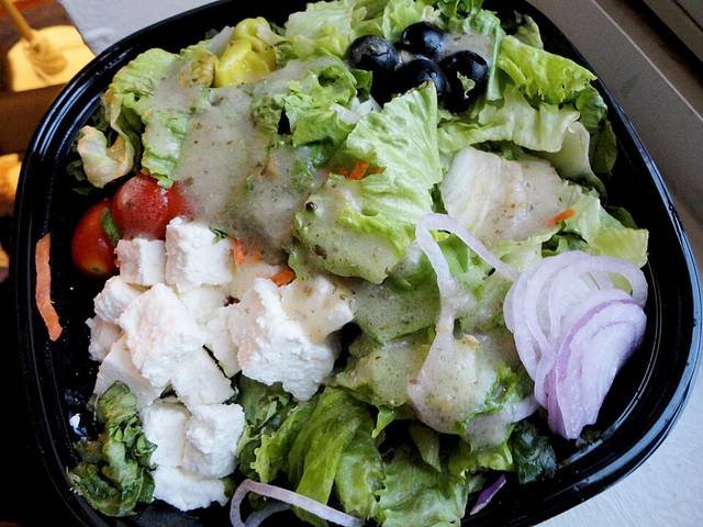 Ingredients and preparation for horiatiki greek salad